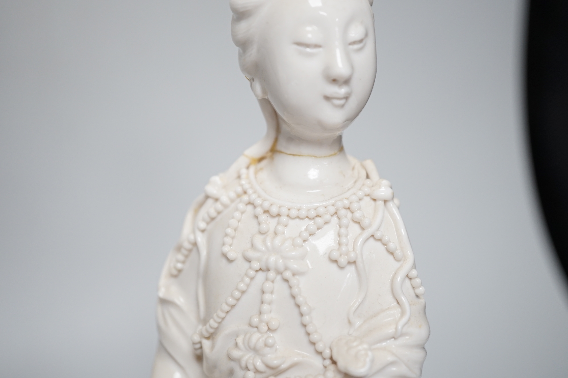 Three Chinese blanc de chine figures of Guanyin, 25cm